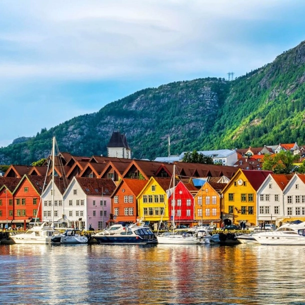 Colorful houses in Bergen, Norway, lined up along the harbor, creating a picturesque and vibrant landscape.